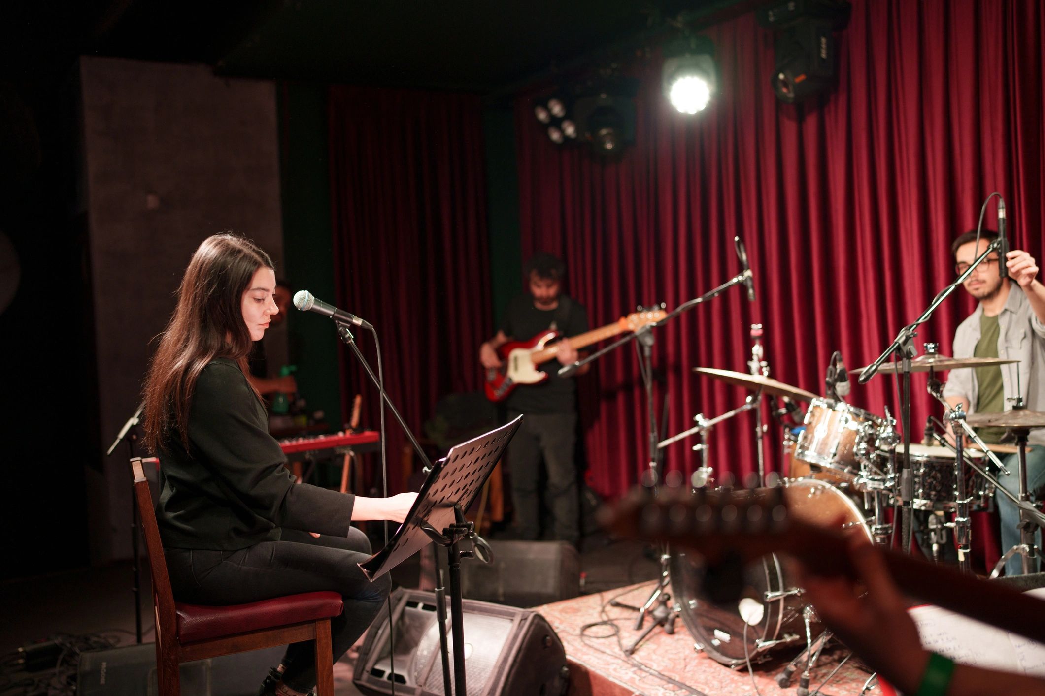 Full band rehearsing together on stage